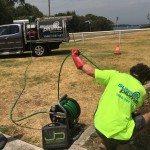 sureplumb team conducting drain unblockage in wollongong