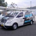 sureplumb emergency plumber van out on a worksite