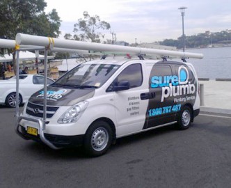 sureplumb emergency plumber van out on a worksite